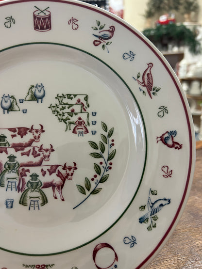 Decorative Christmas plate angled view showing multicolor animals and seasonal border