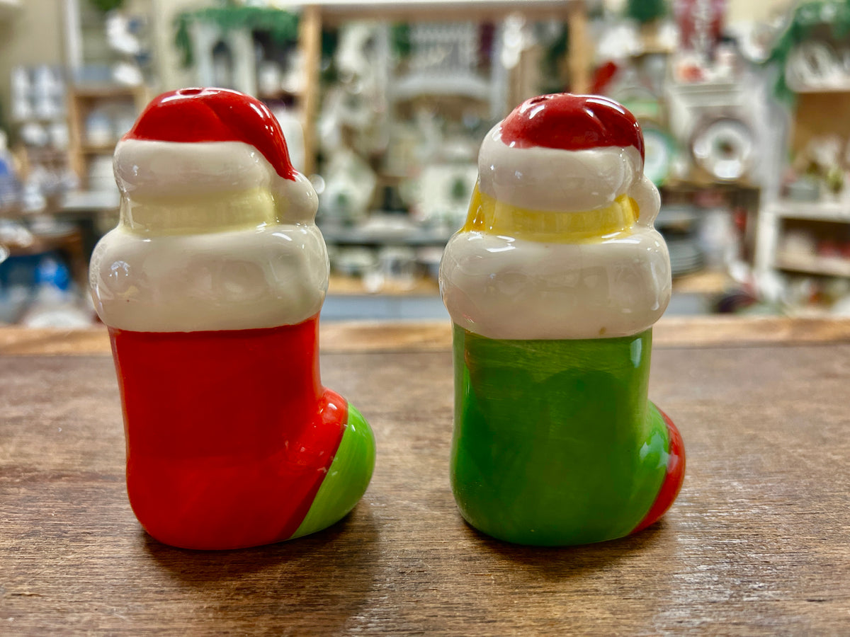 Pair of dog Christmas salt and pepper shakers, red and green with Santa hats