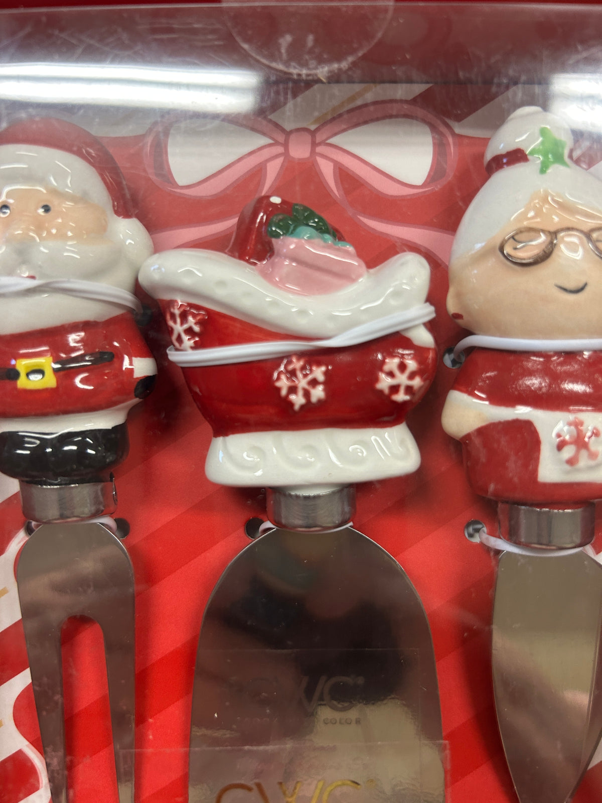 Santa and helper figurine cheese knife set with handles and metal blades