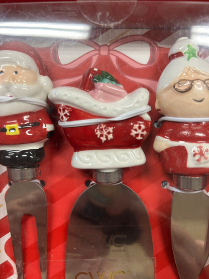 Santa and helper figurine cheese knife set with handles and metal blades