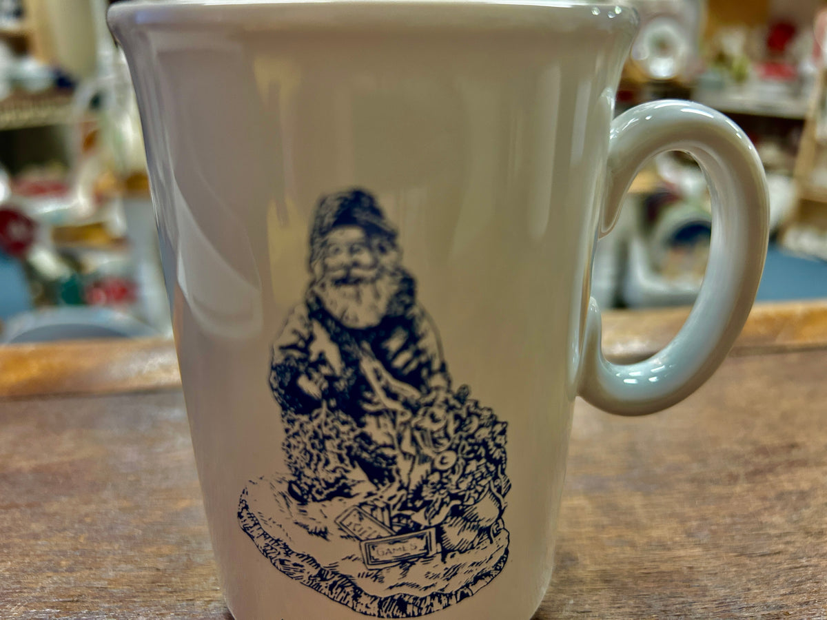 White ceramic mug with blue Jolly Ole St. Nick portrait and side handle