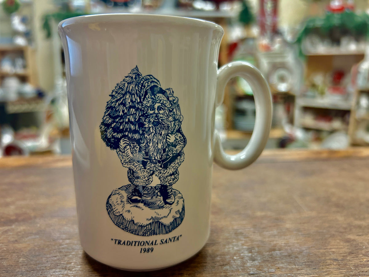 Ceramic mug with dark blue Traditional Santa 1989 design and “Traditional Santa” text