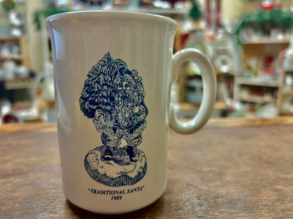 Ceramic mug with dark blue Traditional Santa 1989 design and “Traditional Santa” text