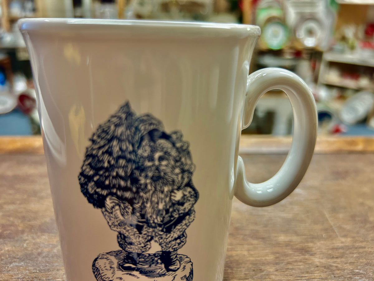 Ceramic mug with dark blue Traditional Santa figure graphic on front