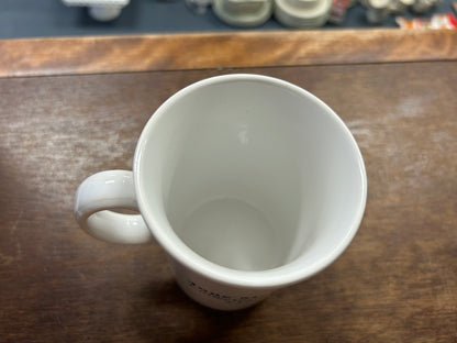 Ceramic mug interior view with white interior and left-side handle