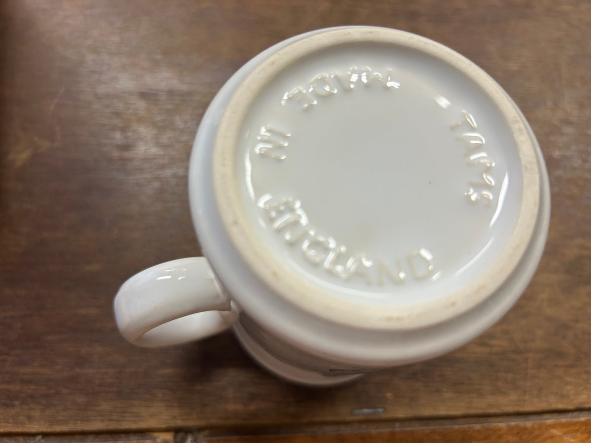 Ceramic mug base with embossed stamp reading “Made in England”