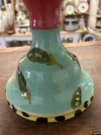 Green ceramic pedestal base for vegetable bowl with black-dotted trim