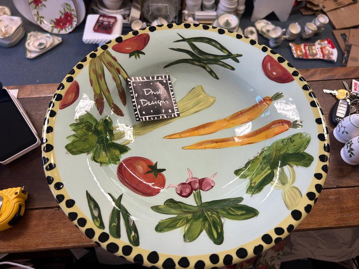 Vegetable bowl top with painted vegetables, green herbs, and dotted black edging