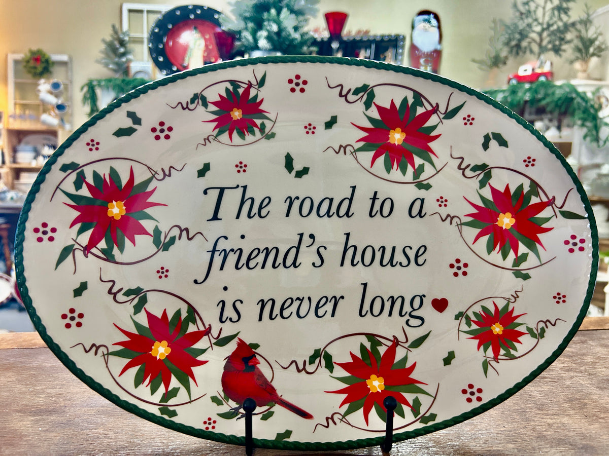 Oval Christmas platter with red cardinal and green poinsettia wreath border, message center