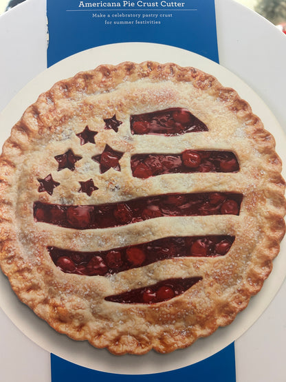 Flag-shaped pie crust cutter on round plate, shown in blue retail package