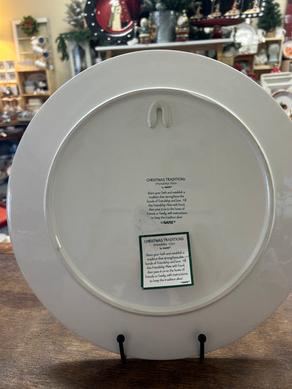 White round platter back with small label and hanging hook holes