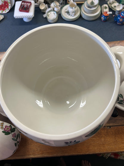Empty ceramic ladle bowl with white interior and smooth curved rim
