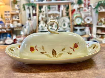 Ceramic butter dish with matching lid and autumn leaf floral design, gold rim