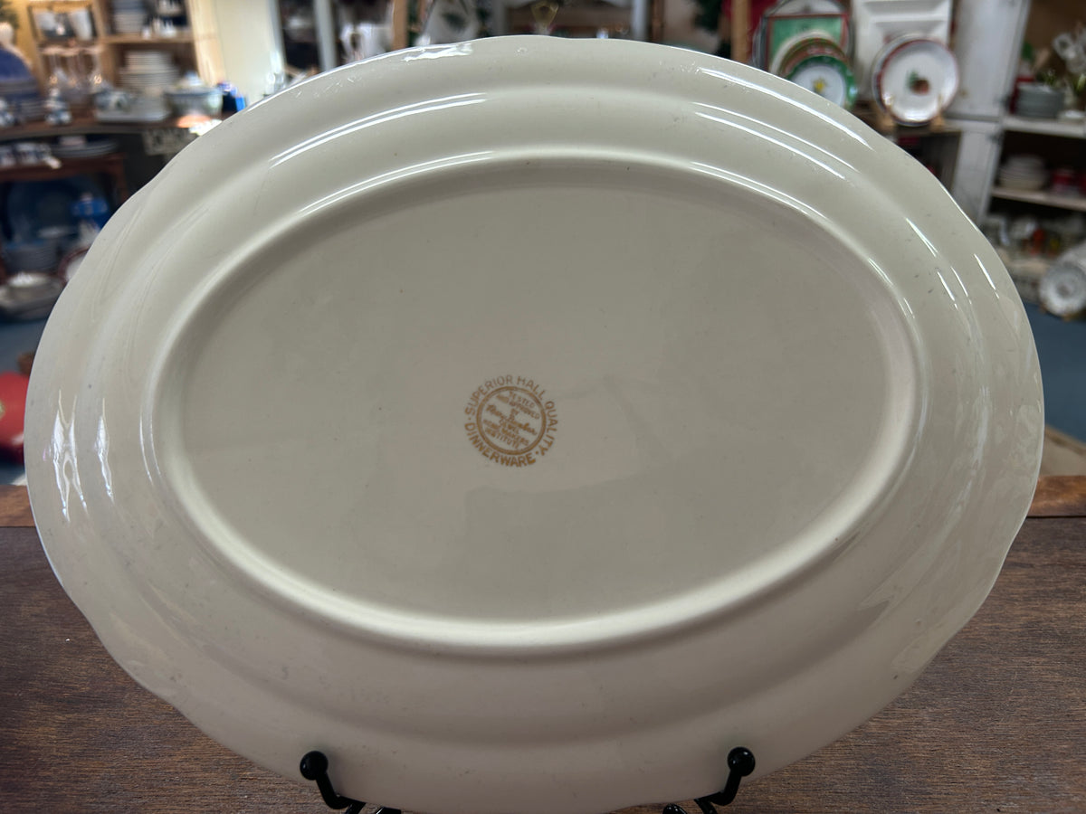 White ceramic platter base with center maker stamp