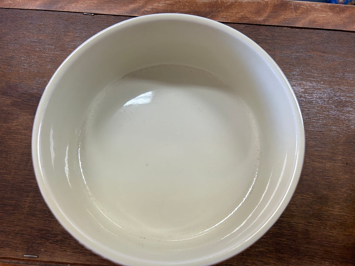 Ceramic souffle bowl interior view with smooth white glaze and shallow bowl