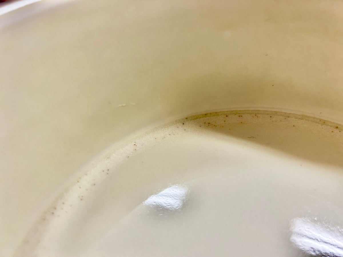 Ceramic souffle bowl close-up of glossy white interior glaze