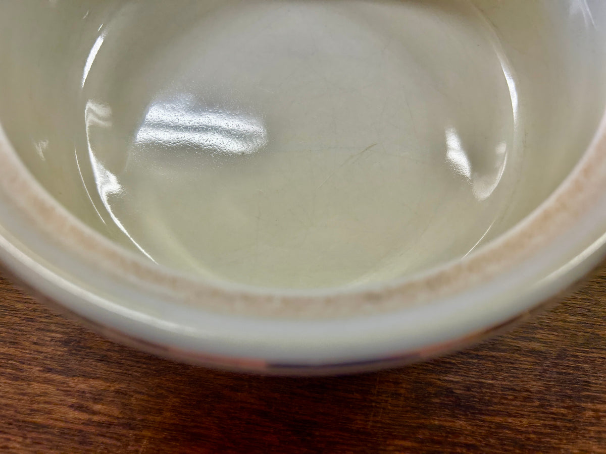 Ceramic casserole dish interior close-up, white glossy glaze