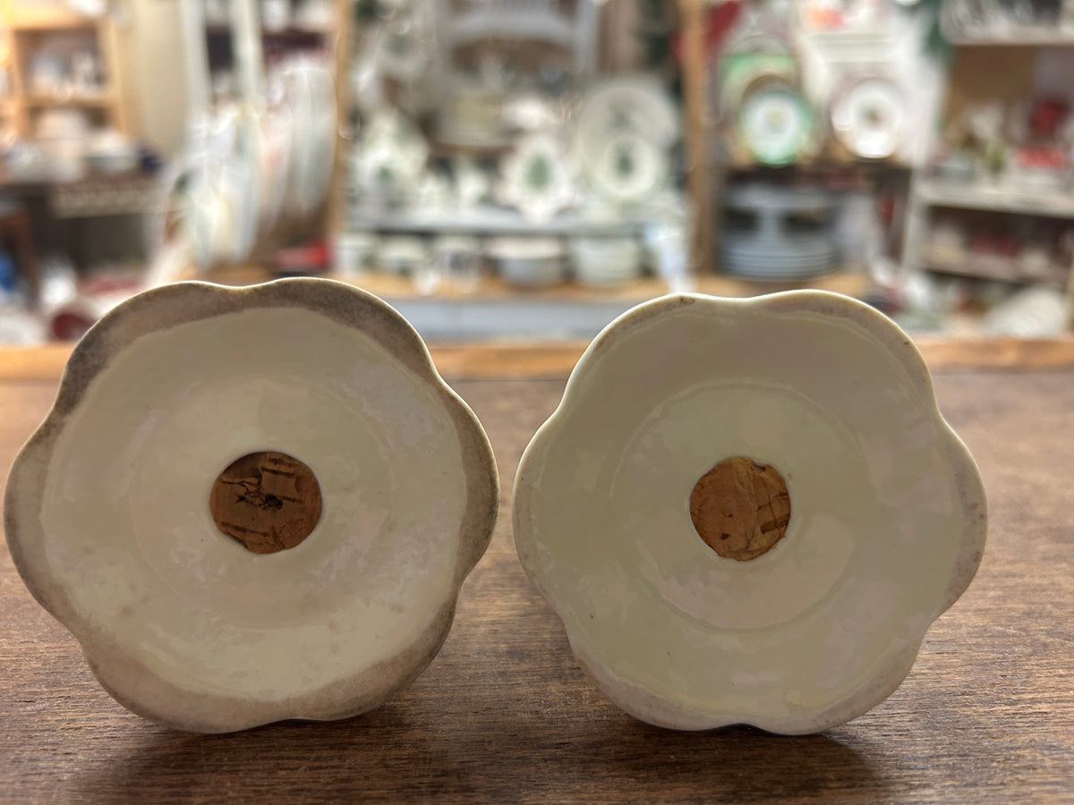 Ceramic salt and pepper shakers, white with cork bases viewed from bottom