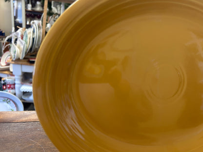 Orange oval platter close-up showing glossy glaze and smooth center