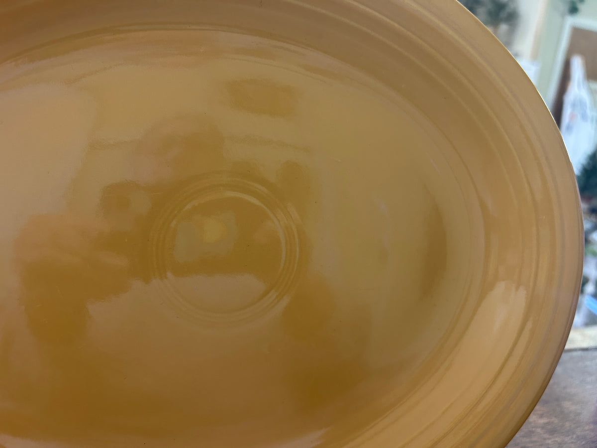 Close-up of the orange platter's glossy center and concentric ridges