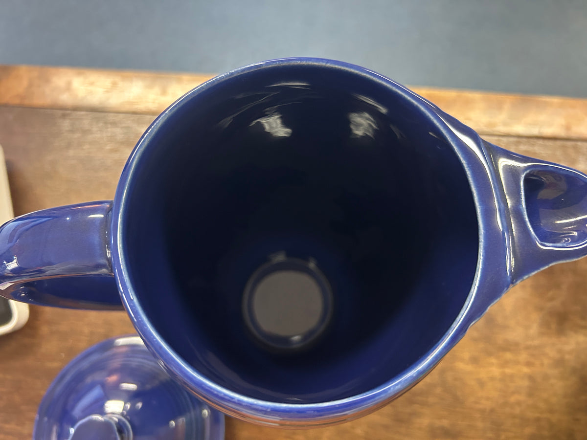 Open cobalt blue coffee pot showing its deep interior and spout