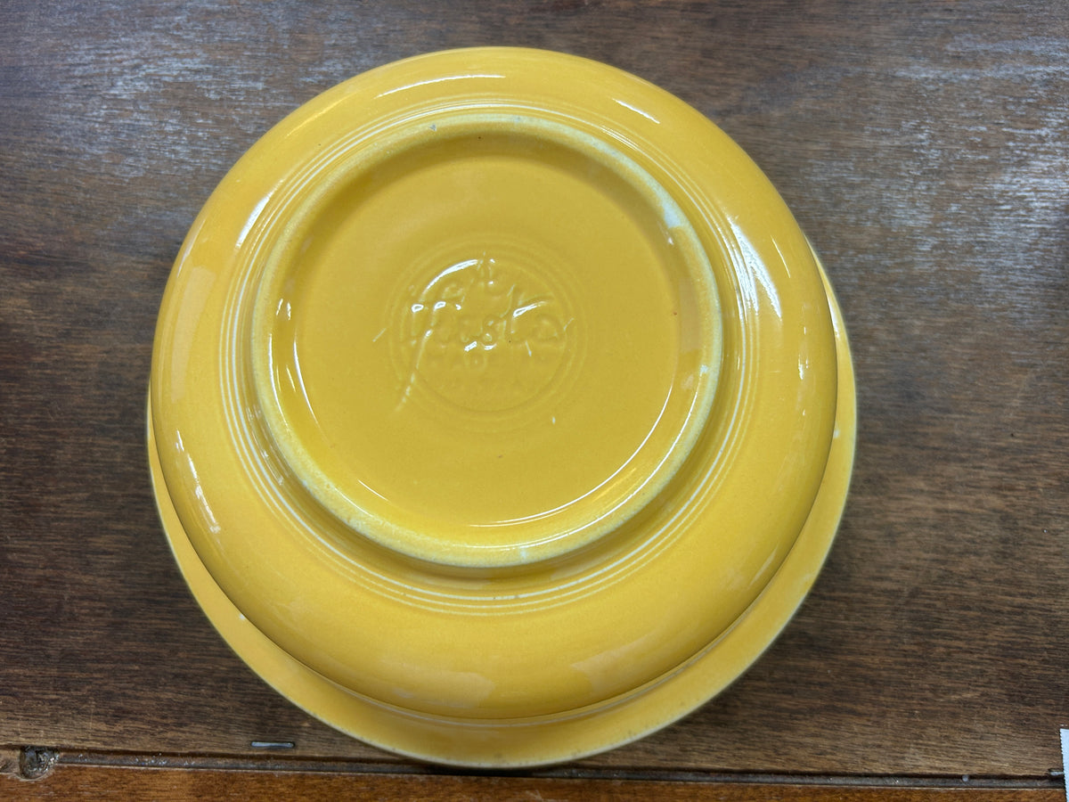 Fiestaware yellow rimmed bowl, 8.5 inches, shown upside down with embossed base