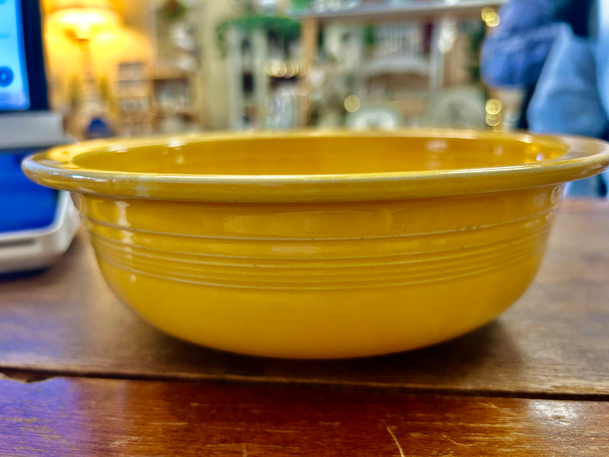 Fiestaware yellow rimmed bowl, 8.5 inches, shown from the side with ridged details