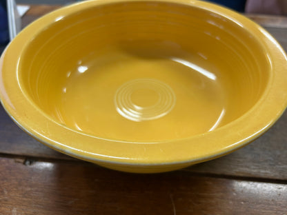 Fiestaware yellow rimmed bowl, 8.5 inches, showing its wide rim and concentric base rings