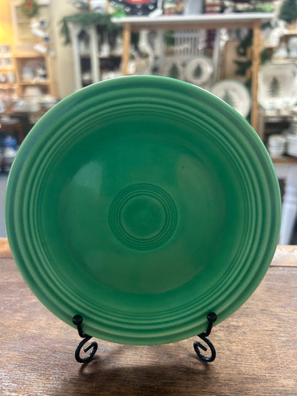 Fiestaware green plate with a glossy finish and concentric raised rings