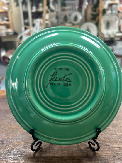 Green Fiestaware saucer plate underside with maker's mark and raised rings