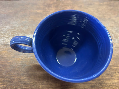 Top view of the blue cup showing its glossy interior and loop handle