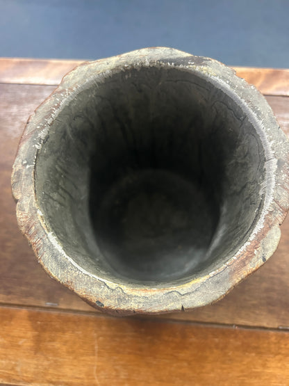 Provencal tree crock viewed from above, showing its deep, dark interior and uneven rim.