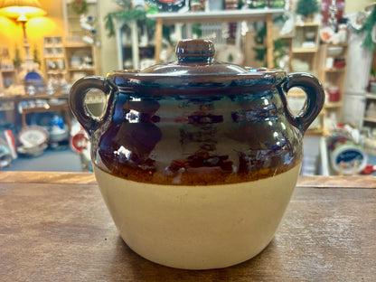 Two-handle stoneware bean pot with glossy brown glaze, tan base, and fitted lid