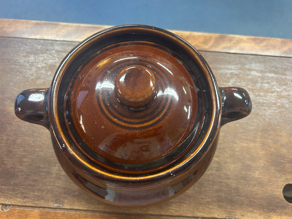 Bean pot with fitted lid and two side handles, viewed from above