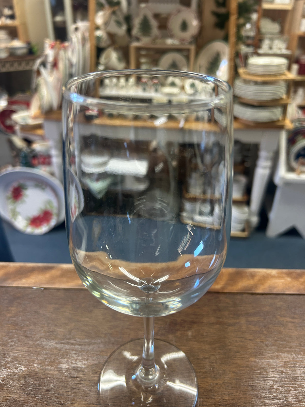 Clear wine glass with a rounded bowl, slender stem, and round foot