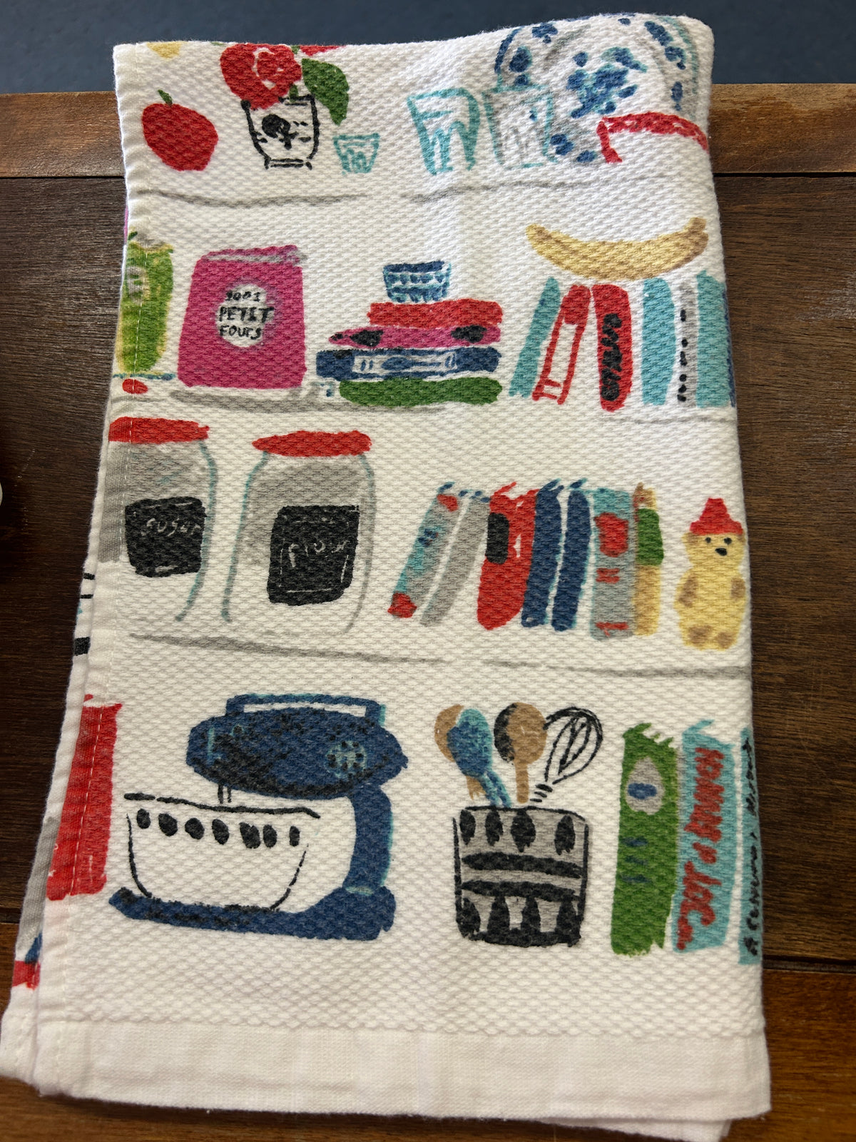 Kate Spade kitchen dish towel with colorful illustrated kitchen items and a textured weave.