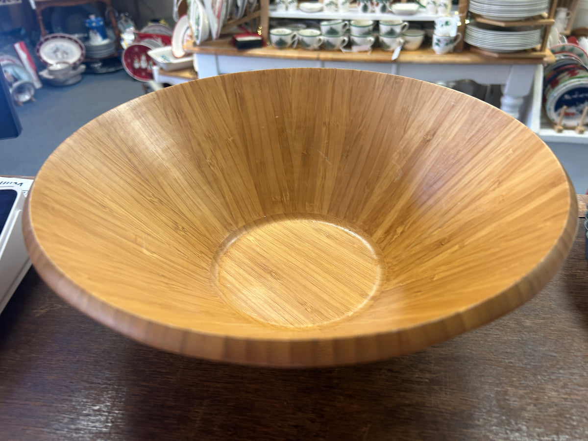 Wooden salad bowl viewed from above, showing its smooth interior and flat base