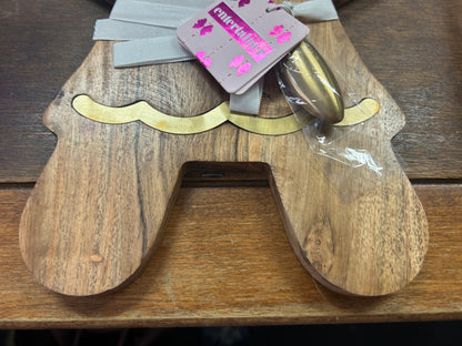 Lower portion of the wooden gingerbread board with gold accent trim