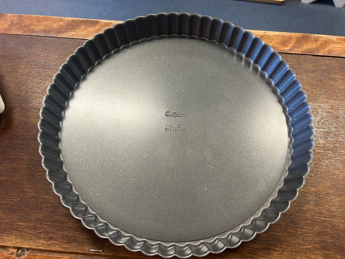 Top view of the fluted silver tart pan with removable bottom