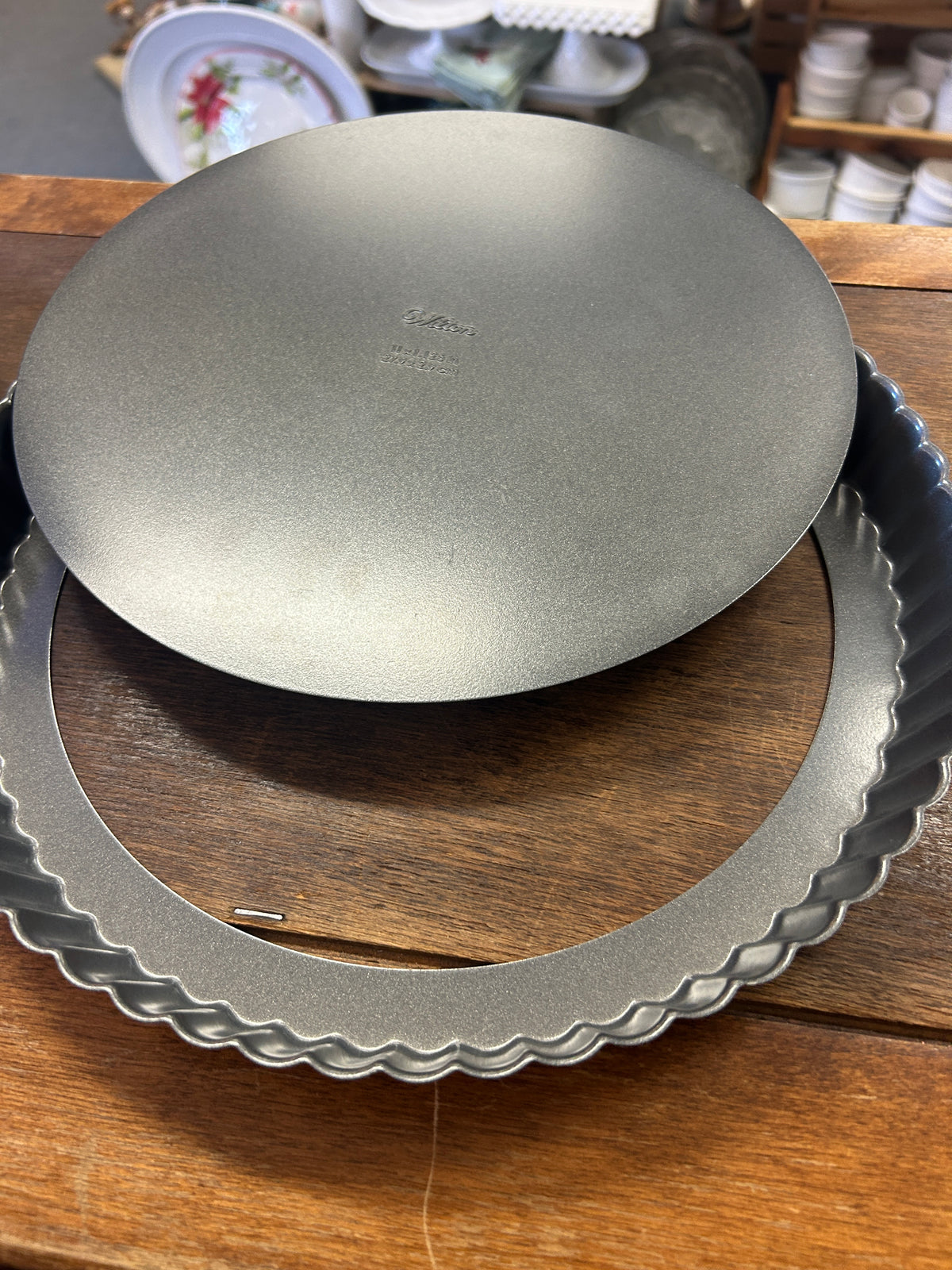 Removable round base lifted from the fluted tart pan