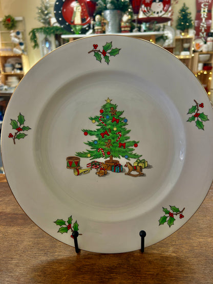 Meiwa holiday plate with a Christmas tree, gifts, and holly on a white background