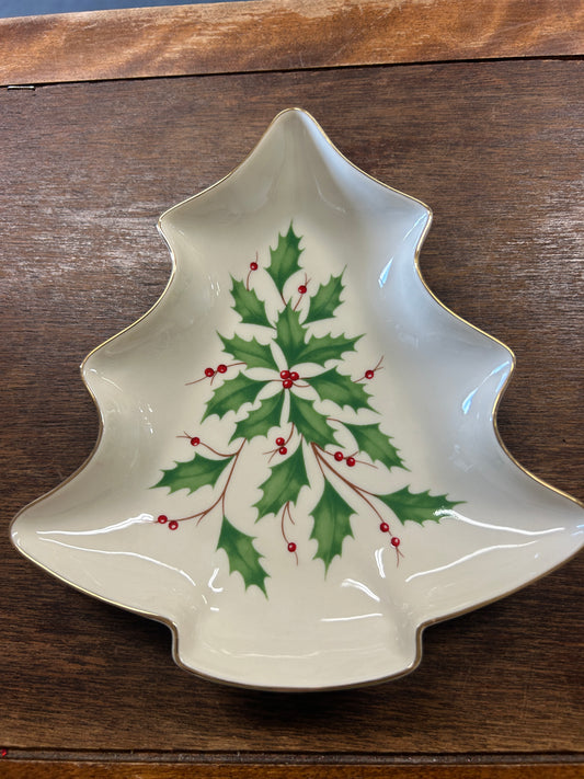 White ceramic Christmas tree-shaped bowl with green holly and red berry accents
