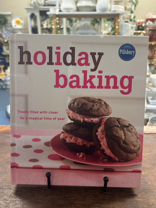 Pillsbury holiday baking cookbook with cover text and stacked chocolate cookies