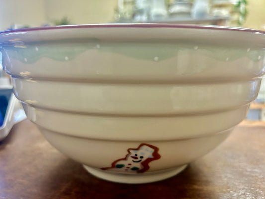 Cream ceramic bowl with gingerbread-style star motif on the front