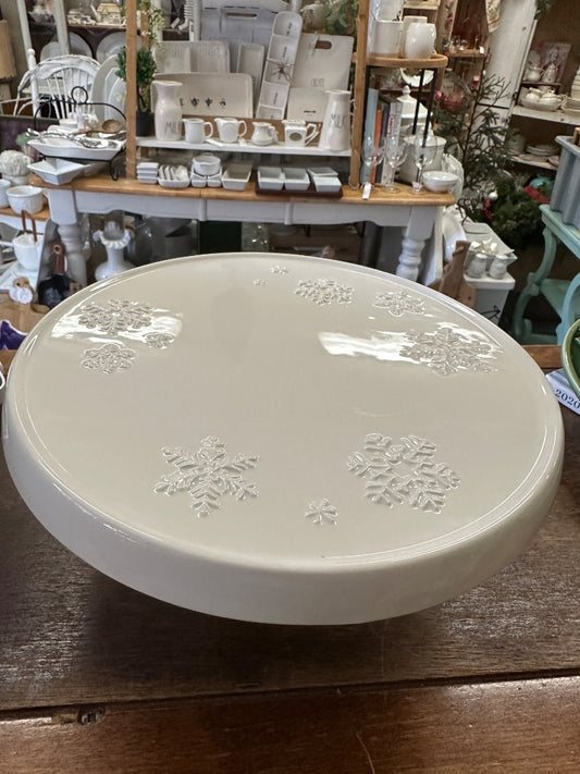 White Hallmark snowflake cake stand with round embossed top and pedestal base