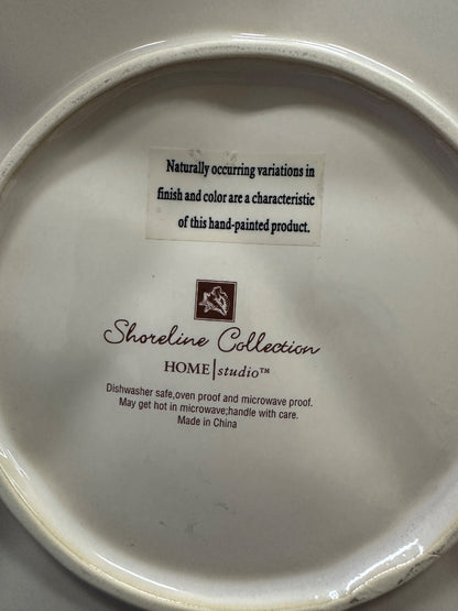 Starfish platter underside with Shoreline Collection Home Studio branding and care text