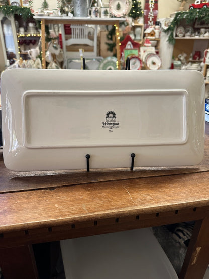 White ceramic Winterfest platter, rectangular with raised rim and center logo