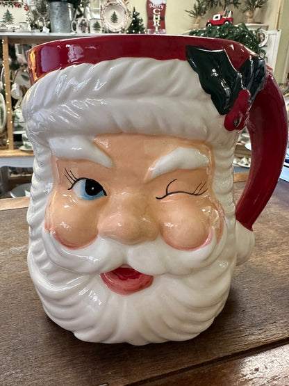 Red and white Santa face utensil crock with side handle