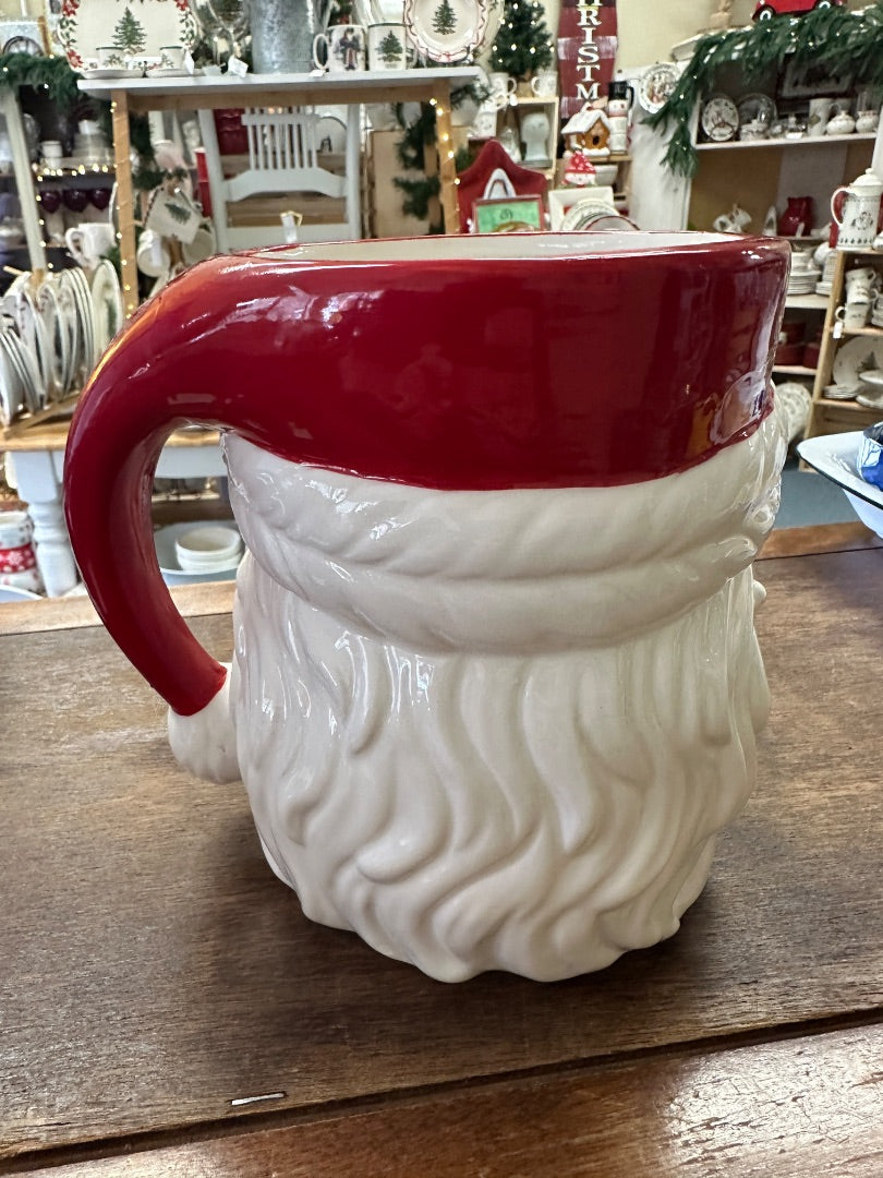 Red and white Santa utensil crock with curved handle, rear view