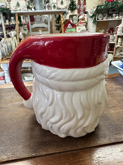 Red and white Santa utensil crock with curved handle, rear view
